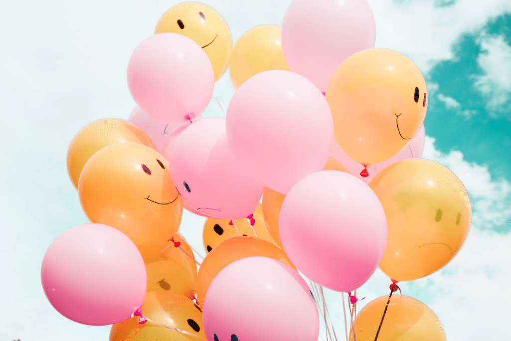 Balloons with happy faces on