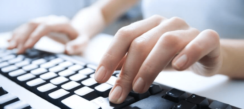 Hands typing on keyboard