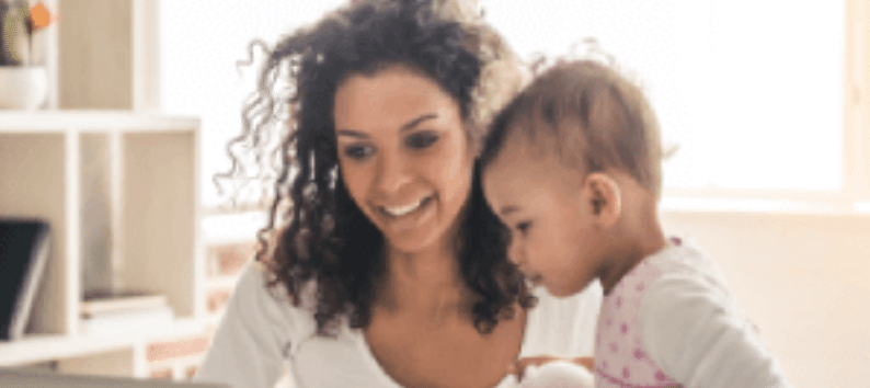 Woman with baby smiling